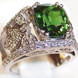 A ring featuring a 3-carat Tsavorite set in platinum with pavé diamonds.