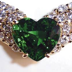 A pendant set with a 3.5-carat Tsavorite heart set in 18 carat gold, and pavé diamonds.