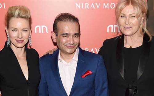 Nirav Modi (centre) has officially been charged after being linked to a billionaire bank fraud. Image courtesy: Sky News