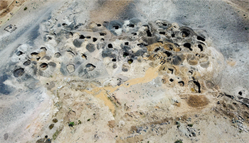 Taken from drone footage this shot clearly shows the numerous pits seen in the mining areas. Image courtesy Wim Vertriest/GIA