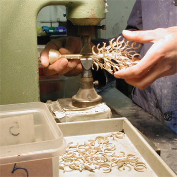 A team member removing pieces from a cast tree