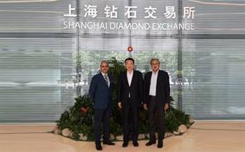 Mehul Shah (left) and Anoop Mehta (right) of Bharat Diamond Bourse pose for a photo with Lin Qiang, president Shanghai Diamond Exchange during a visit to China last week