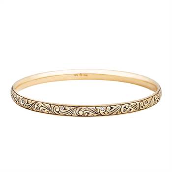 Floral scroll bangle with diamonds by Victoria Buckley.