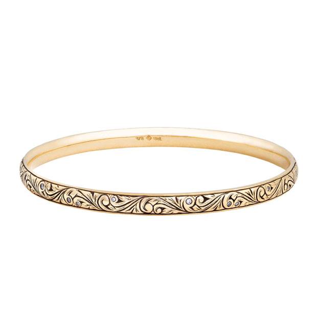 Floral scroll bangle with diamonds by Victoria Buckley.