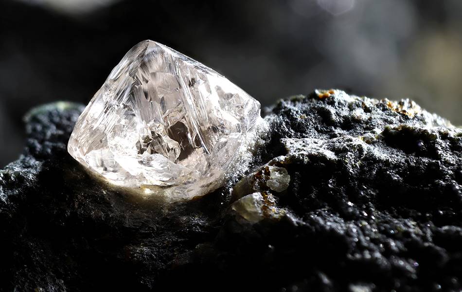 Natural diamond crystal nestled in kimberlite. Image: Shutterstock