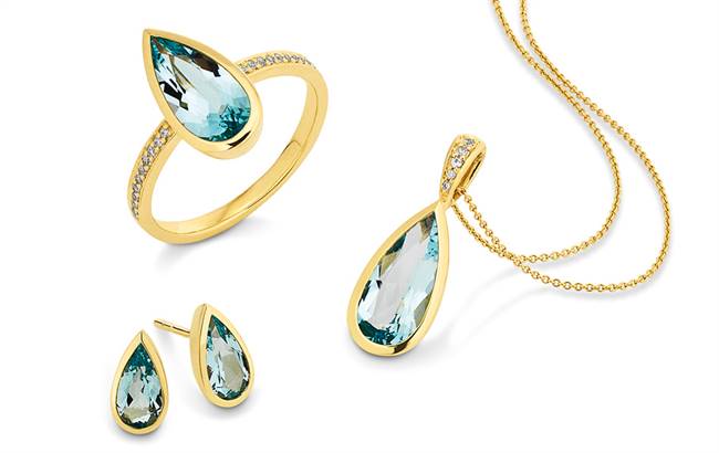 Yellow gold ring and matching earrings and pendant set with diamonds and London Blue topaz.