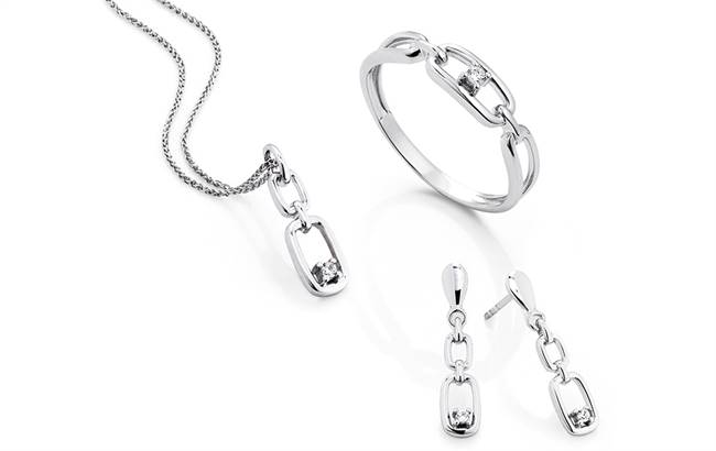 White gold pendant, ring and earrings set with diamonds.