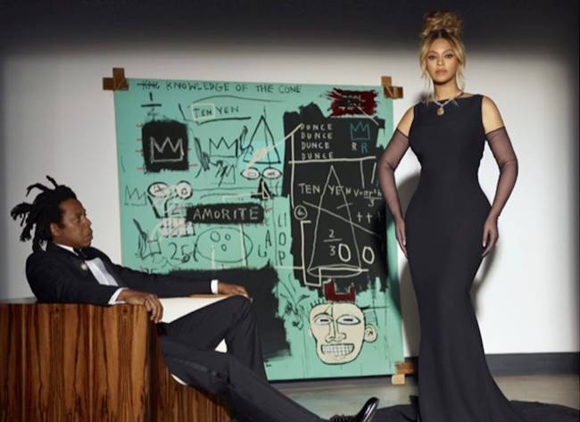 Beyonce – wearing the Tiffany Diamond – and husband Jay Z pose with Jean-Michel Basquiat