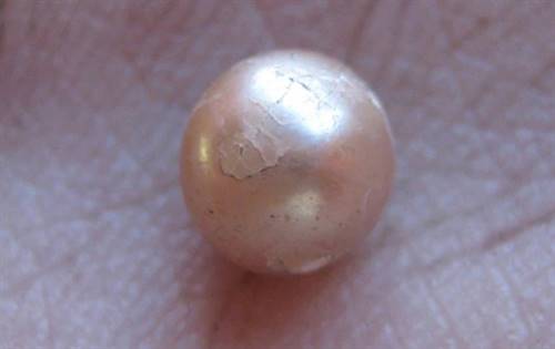   The almost perfectly round, natural pearl is believed to be about 2,000 years old