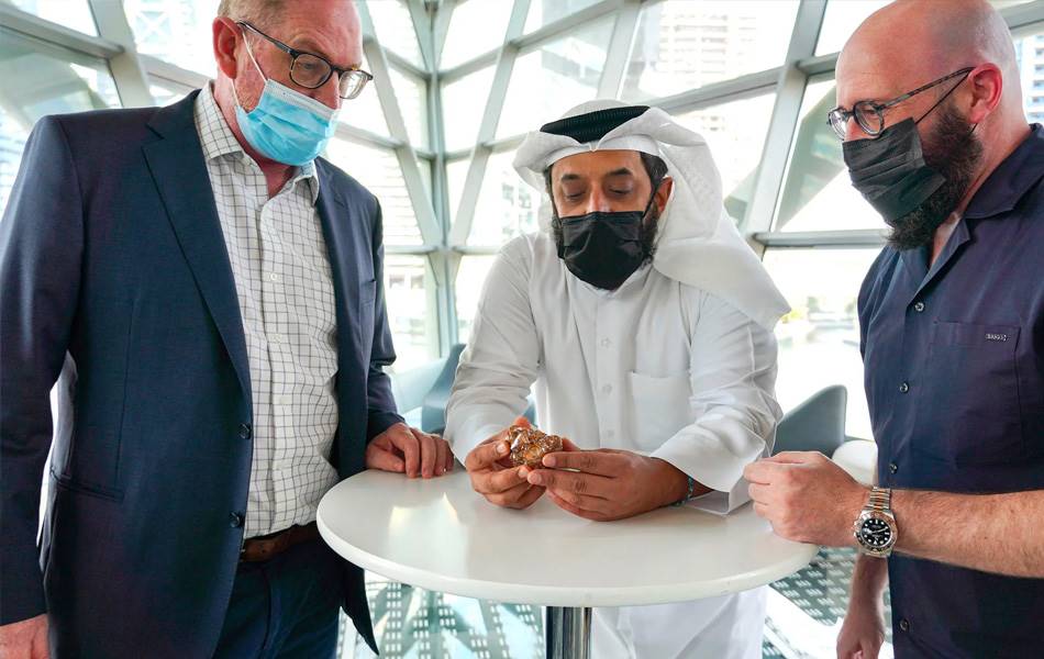 L to R: Martin Leake, Ahmed Bin Sulayem, and Jacob Gill with the 1086.10-carat rough diamond.