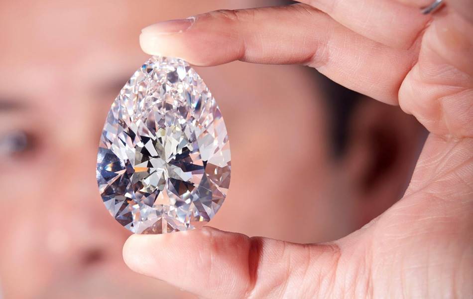 Holding 'The Rock', a 228.31-carat pear diamond is Christie’s international head of jewellery, Rahul Kadakia. Source: Christie's