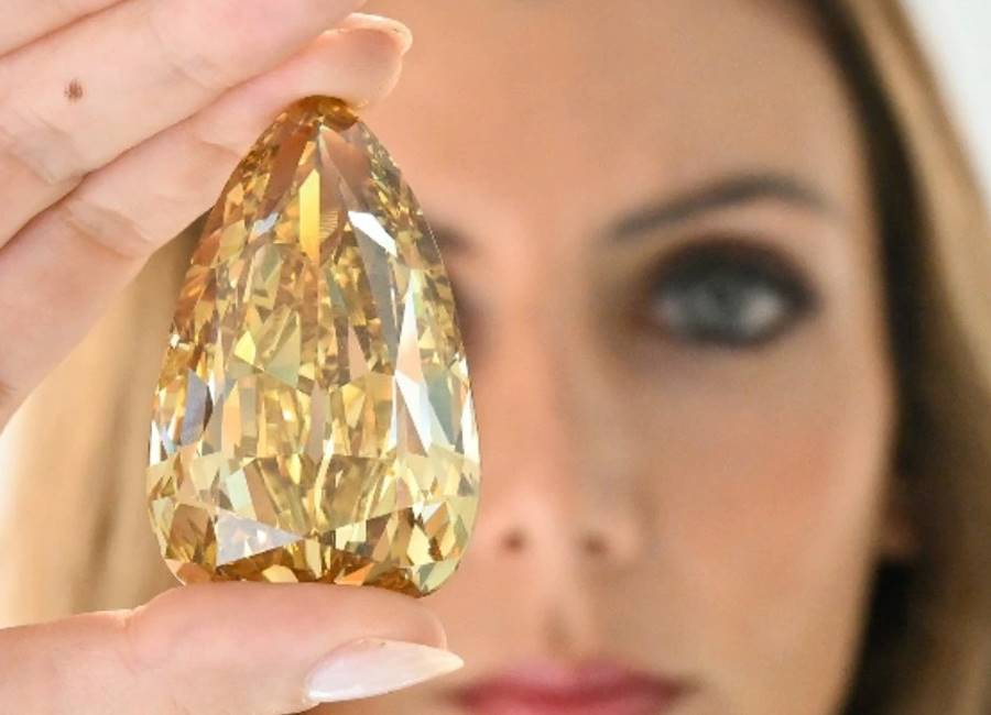 The 303-carat pear-shaped Golden Canary diamond is a fancy colour brown-yellow stone that is the largest diamond to have been graded as internally flawless by the Gemological Institute of America. It fetched $US12.4 million ($AU18.35 million) at Sotheby’s. Image: Cedric Ribeiro