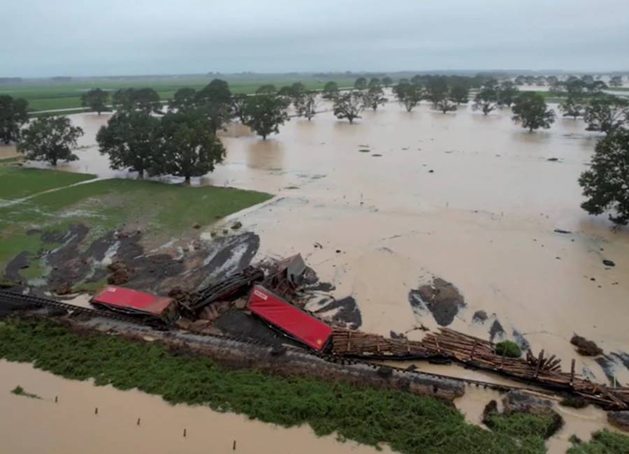 In late January record rainfall in Auckland and the surrounding areas led to flooding which took the lives of four people and caused extensive property damage. Image above is of floodwaters that have derailed a train in Te Puke. Image: David Holwerda, Reuters