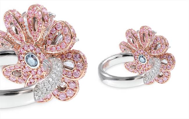 The lotus design is set in 18-carat rose gold, with petals unfurling from a 0.12-carat blue diamond, symbolising water.