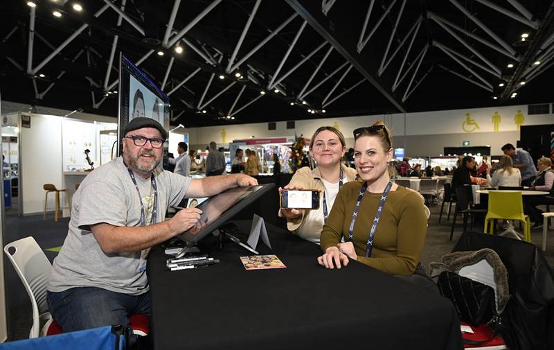 Sydney Cartoonist Brett Bowen with a few of his 