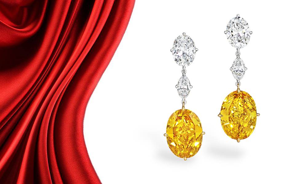 A pair of fancy vivid orange-yellow diamond earrings will be the headline act of an upcoming Christie’s auction in New York. | Source: Christies