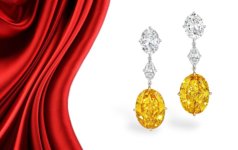 A pair of fancy vivid orange-yellow diamond earrings will be the headline act of an upcoming Christie’s auction in New York. | Source: Christies