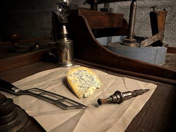 Bleu de Septmoncel cheese on a traditional Jurassian gemcutting bench.