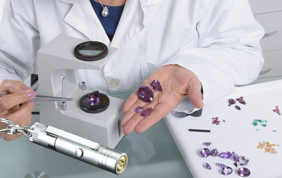 <b>L to R:</b> Ultraviolet Torch; Gemmologist using a dichroscope. | Source: Shutterstock