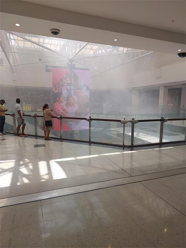 A large cloud of smoke rises from the ground floor of Westfield St Lukes after a fog cannon was set off during a raid on a jewellery store.