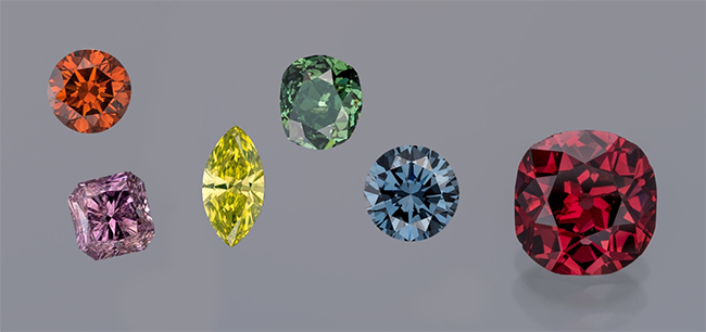 The collection features stones in various colours, from peach to teal, and sizes as large as 9.49 carats.