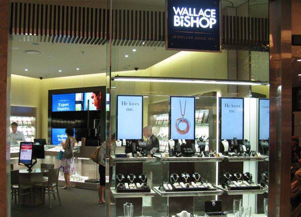 Large digital screens illuminate the front windows to draw attraction from passing customers.