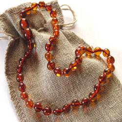 The website no longer contains unsubstantiated therapeutic claims regarding amber necklaces