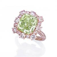 An intense green diamond ring broke a world auction record after selling for $3.9 million