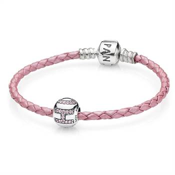 The new set features a braided leather bracelet and sterling silver charm with cubic zirconia