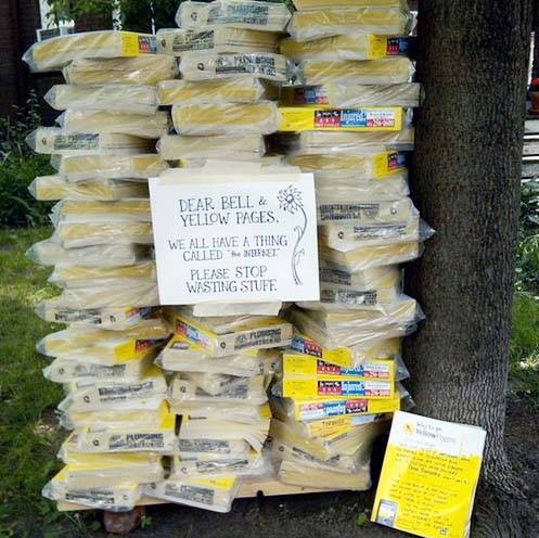 A group of Montreal protestors stand up against the Yellow Pages, calling it 'waste'.