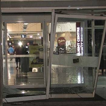 The offender allegedly entered the shopping centre by driving through the doors. Source: Seven News