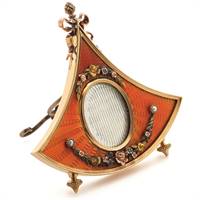 A gold and enamel miniature frame by Carl Fabergé, circa 1900