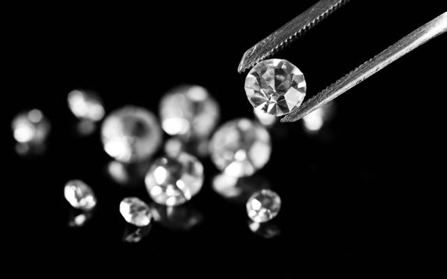 Ten diamond traders are believed to have been involved in a grading report alteration scheme