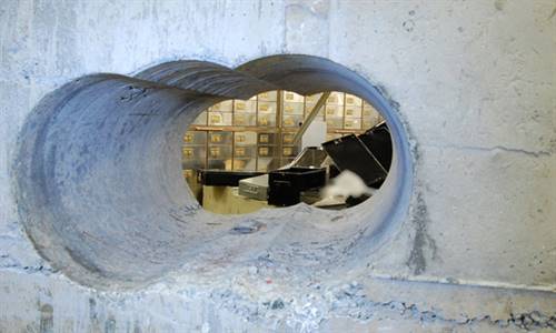 The two metre-thick, concrete-reinforced vault wall was drilled