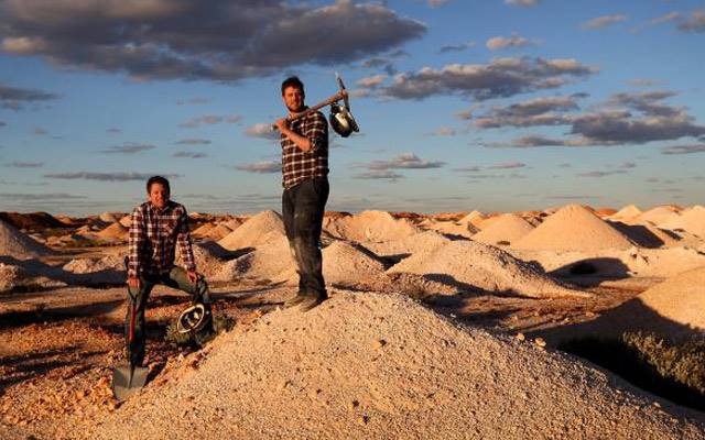 Daniel Becker, left, and Justin Lang in the opal fields outside Coober Pedy. Image courtesy: <a href="http://www.theaustralian.com.au/news/nation/gem-next-in-grip-of-sparkle-fever-and-they-dig-it/news-story/7b4d511b7ebd3daea4e50c79e822333d?login=1" target="_blank">The Australian</a>, Kelly Barnes