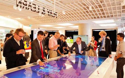 Customers browse at a Telstra store. Image courtesy: Retail Doctor Group