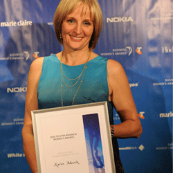 Karin Adcock holding her award